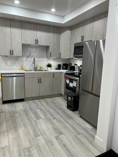 19 Walcrest Row Se, Calgary, AB - Indoor Photo Showing Kitchen With Upgraded Kitchen