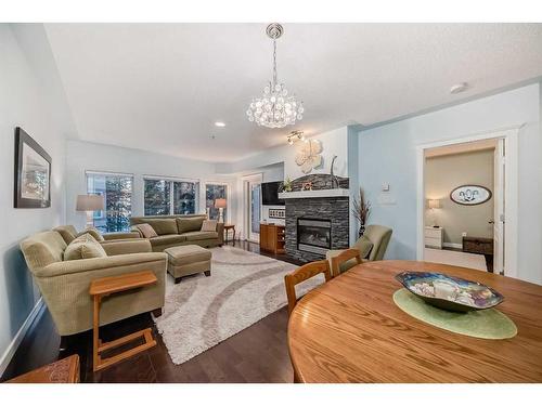 116-30 Discovery Ridge Close Sw, Calgary, AB - Indoor Photo Showing Living Room With Fireplace