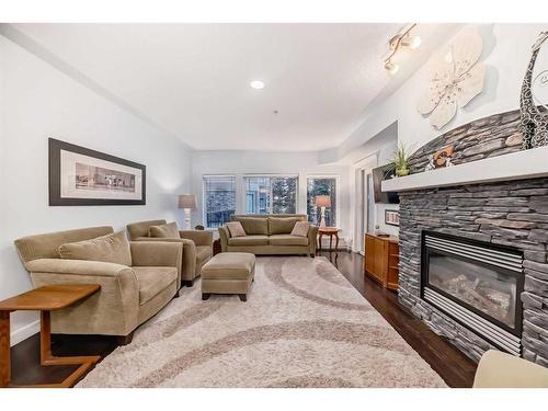 116-30 Discovery Ridge Close Sw, Calgary, AB - Indoor Photo Showing Living Room With Fireplace