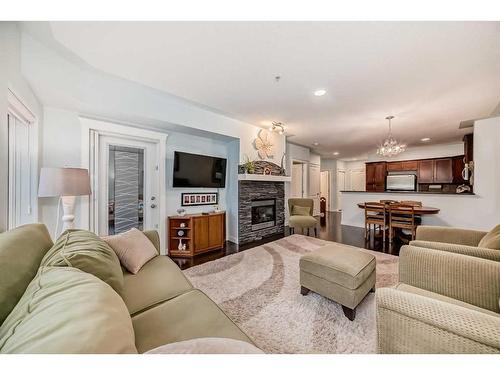 116-30 Discovery Ridge Close Sw, Calgary, AB - Indoor Photo Showing Living Room With Fireplace