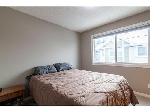 72 New Brighton Point Se, Calgary, AB - Indoor Photo Showing Bedroom