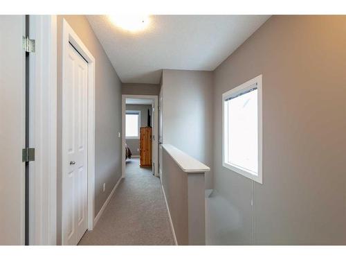 72 New Brighton Point Se, Calgary, AB - Indoor Photo Showing Bedroom