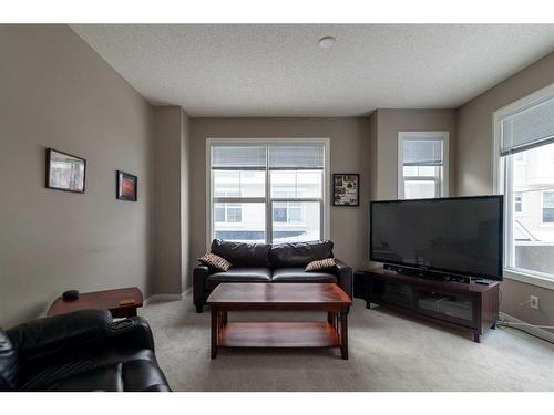 72 New Brighton Point Se, Calgary, AB - Indoor Photo Showing Living Room