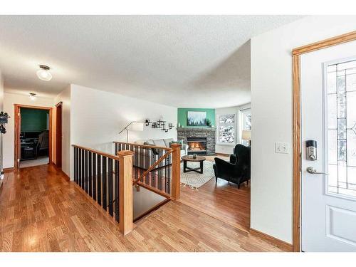 1510 11 Avenue Se, High River, AB - Indoor Photo Showing Other Room With Fireplace