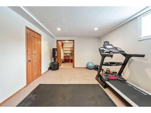 1510 11 Avenue Se, High River, AB - Indoor Photo Showing Gym Room