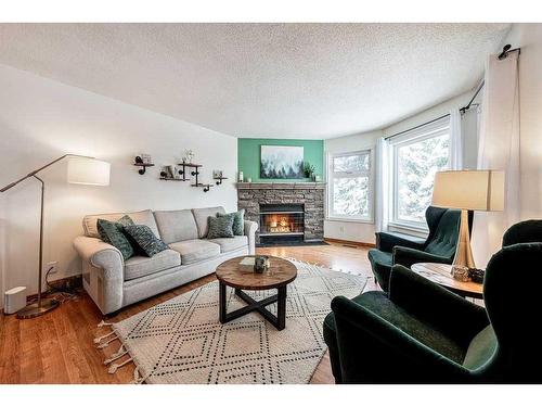 1510 11 Avenue Se, High River, AB - Indoor Photo Showing Living Room With Fireplace