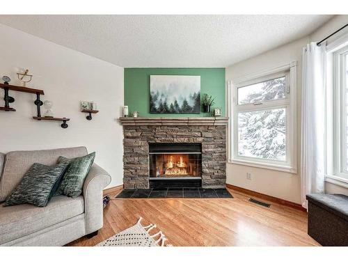 1510 11 Avenue Se, High River, AB - Indoor Photo Showing Living Room With Fireplace