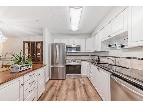 3106-3000 Millrise Point Sw, Calgary, AB - Indoor Photo Showing Kitchen With Stainless Steel Kitchen With Double Sink With Upgraded Kitchen