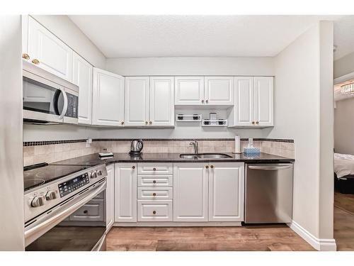 3106-3000 Millrise Point Sw, Calgary, AB - Indoor Photo Showing Kitchen With Double Sink