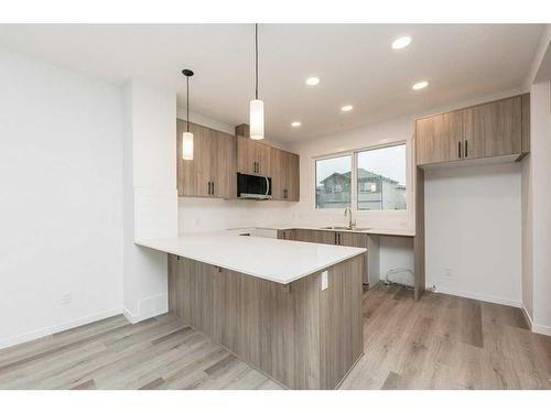 822 Creekside Boulevard Sw, Calgary, AB - Indoor Photo Showing Kitchen