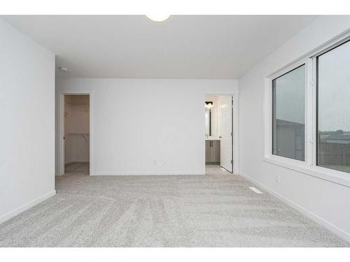 822 Creekside Boulevard Sw, Calgary, AB - Indoor Photo Showing Other Room