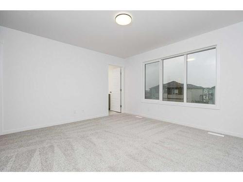 822 Creekside Boulevard Sw, Calgary, AB - Indoor Photo Showing Other Room