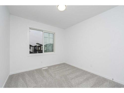 822 Creekside Boulevard Sw, Calgary, AB - Indoor Photo Showing Other Room