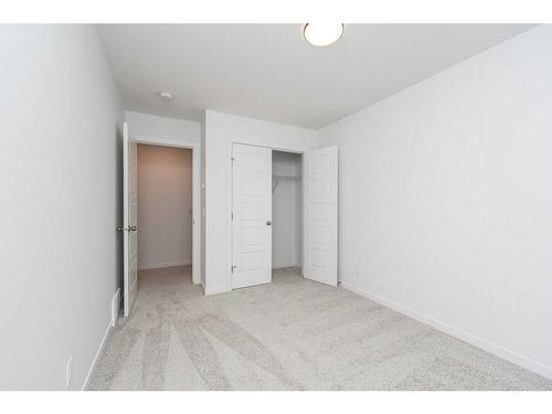 822 Creekside Boulevard Sw, Calgary, AB - Indoor Photo Showing Other Room