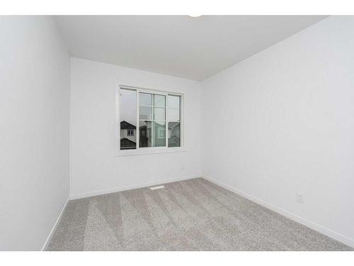 822 Creekside Boulevard Sw, Calgary, AB - Indoor Photo Showing Other Room