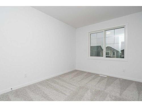 822 Creekside Boulevard Sw, Calgary, AB - Indoor Photo Showing Other Room