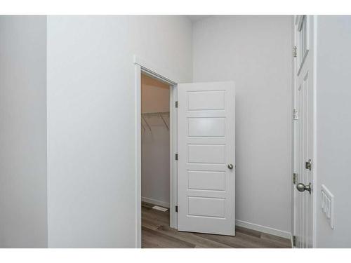 822 Creekside Boulevard Sw, Calgary, AB - Indoor Photo Showing Other Room