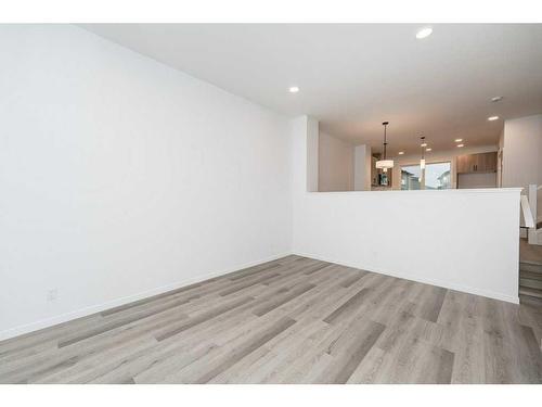 822 Creekside Boulevard Sw, Calgary, AB - Indoor Photo Showing Other Room