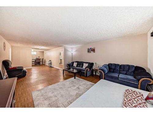 723 Raynard Crescent Se, Calgary, AB - Indoor Photo Showing Living Room