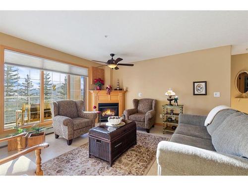 246-6868 Sierra Morena Boulevard Sw, Calgary, AB - Indoor Photo Showing Living Room With Fireplace