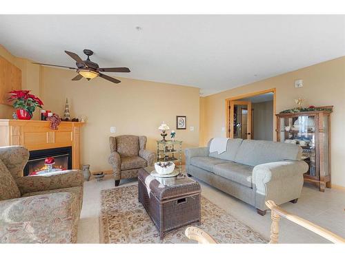 246-6868 Sierra Morena Boulevard Sw, Calgary, AB - Indoor Photo Showing Living Room With Fireplace