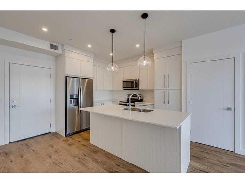 1216-681 Savanna Boulevard Ne, Calgary, AB - Indoor Photo Showing Kitchen With Double Sink With Upgraded Kitchen