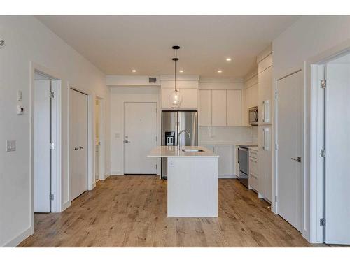 1216-681 Savanna Boulevard Ne, Calgary, AB - Indoor Photo Showing Kitchen