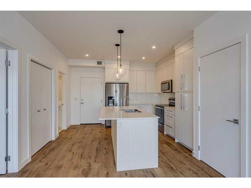 1216-681 Savanna Boulevard Ne, Calgary, AB - Indoor Photo Showing Kitchen With Upgraded Kitchen