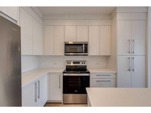 1216-681 Savanna Boulevard Ne, Calgary, AB - Indoor Photo Showing Kitchen