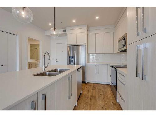 1216-681 Savanna Boulevard Ne, Calgary, AB - Indoor Photo Showing Kitchen With Double Sink With Upgraded Kitchen