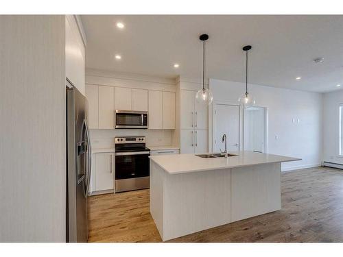 1216-681 Savanna Boulevard Ne, Calgary, AB - Indoor Photo Showing Kitchen With Double Sink With Upgraded Kitchen