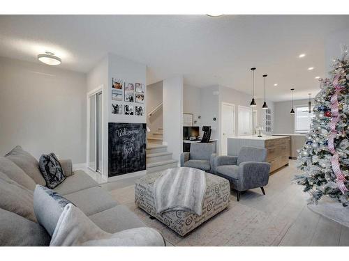 105 Chelsea Drive, Chestermere, AB - Indoor Photo Showing Living Room With Fireplace