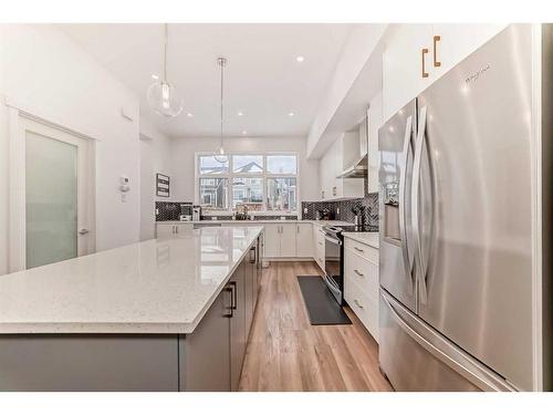 313 Masters Avenue Se, Calgary, AB - Indoor Photo Showing Kitchen With Stainless Steel Kitchen With Upgraded Kitchen