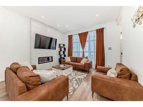 313 Masters Avenue Se, Calgary, AB - Indoor Photo Showing Living Room With Fireplace