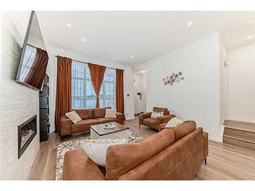 313 Masters Avenue Se, Calgary, AB - Indoor Photo Showing Living Room With Fireplace