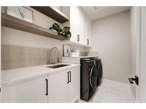 13 Sunvalley View, Cochrane, AB - Indoor Photo Showing Laundry Room