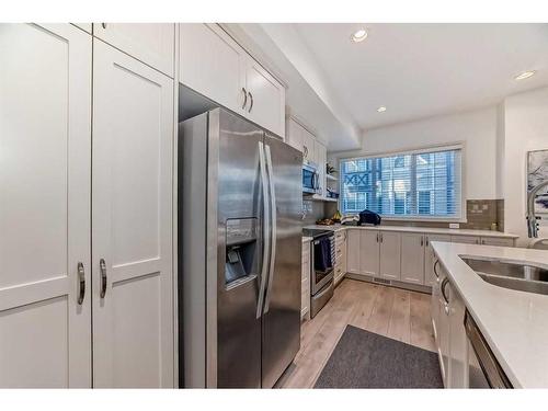 411 Nolanlake Villas Nw, Calgary, AB - Indoor Photo Showing Kitchen With Stainless Steel Kitchen With Double Sink