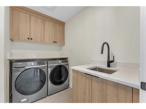 28 North Bridges Glen, Langdon, AB - Indoor Photo Showing Laundry Room