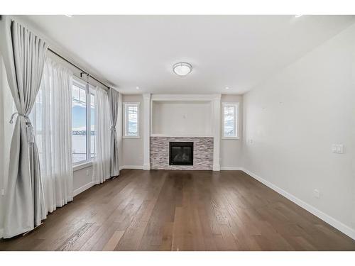 382 Kings Heights Drive Se, Airdrie, AB - Indoor Photo Showing Living Room With Fireplace