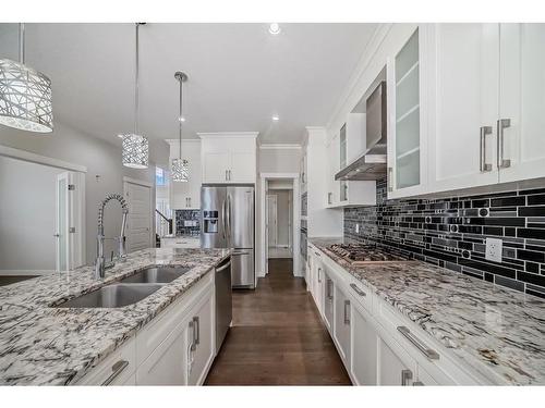 382 Kings Heights Drive Se, Airdrie, AB - Indoor Photo Showing Kitchen With Double Sink With Upgraded Kitchen