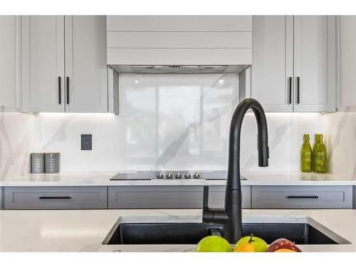 45 Waterford Crescent, Chestermere, AB - Indoor Photo Showing Kitchen With Double Sink