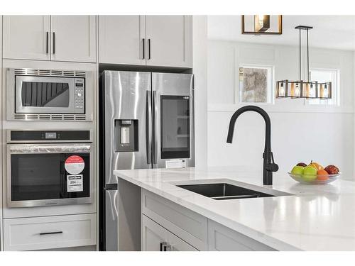 45 Waterford Crescent, Chestermere, AB - Indoor Photo Showing Kitchen With Double Sink With Upgraded Kitchen