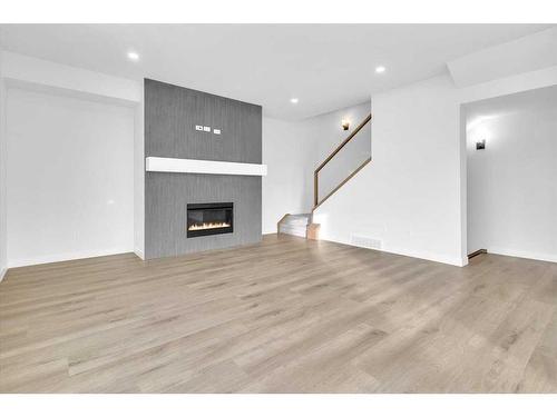 2524 17 Avenue Sw, Calgary, AB - Indoor Photo Showing Living Room With Fireplace