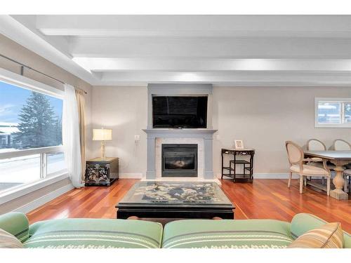 431 Cantrell Drive Sw, Calgary, AB - Indoor Photo Showing Living Room With Fireplace