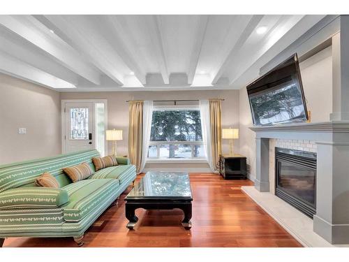 431 Cantrell Drive Sw, Calgary, AB - Indoor Photo Showing Living Room With Fireplace