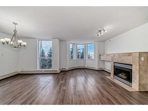 401-1108 6 Avenue Sw, Calgary, AB - Indoor Photo Showing Living Room With Fireplace