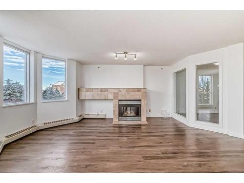 401-1108 6 Avenue Sw, Calgary, AB - Indoor Photo Showing Living Room With Fireplace