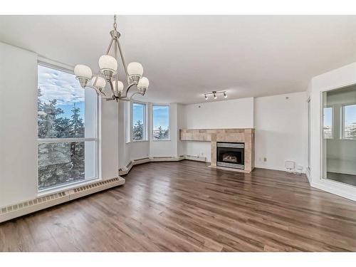 401-1108 6 Avenue Sw, Calgary, AB - Indoor Photo Showing Living Room With Fireplace