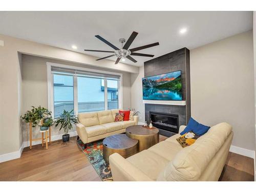 1 Rock Lake Point Nw, Calgary, AB - Indoor Photo Showing Living Room With Fireplace