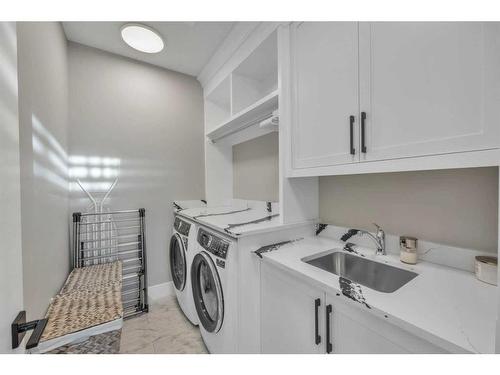 1 Rock Lake Point Nw, Calgary, AB - Indoor Photo Showing Laundry Room